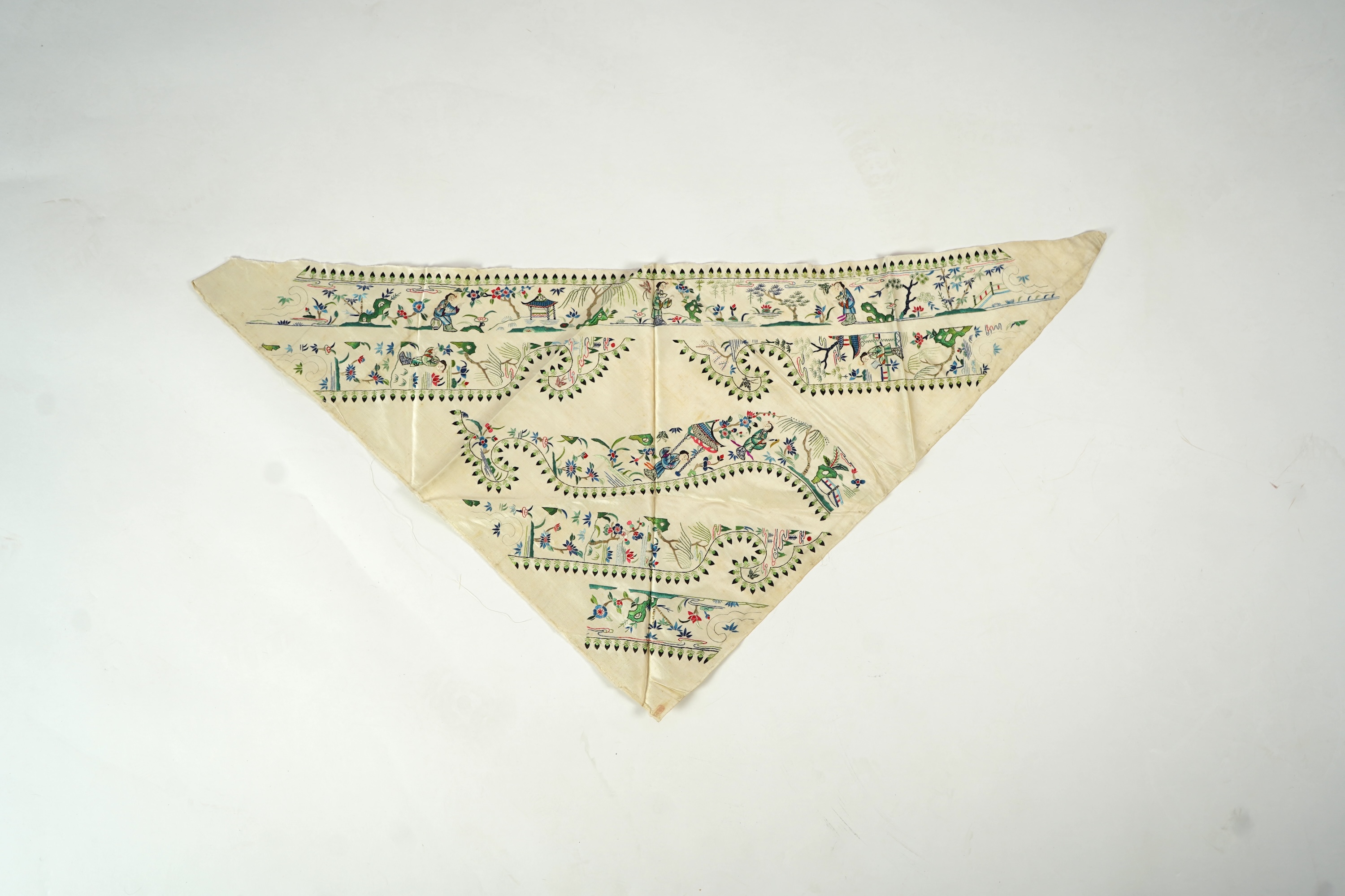 A Chinese embroidered silk panel of uncut robe borders, eleven similar sleeve panels and two other items, late Qing dynasty